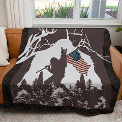 Patriotic Sasquatch blanket draped across a living room couch in front of a window.