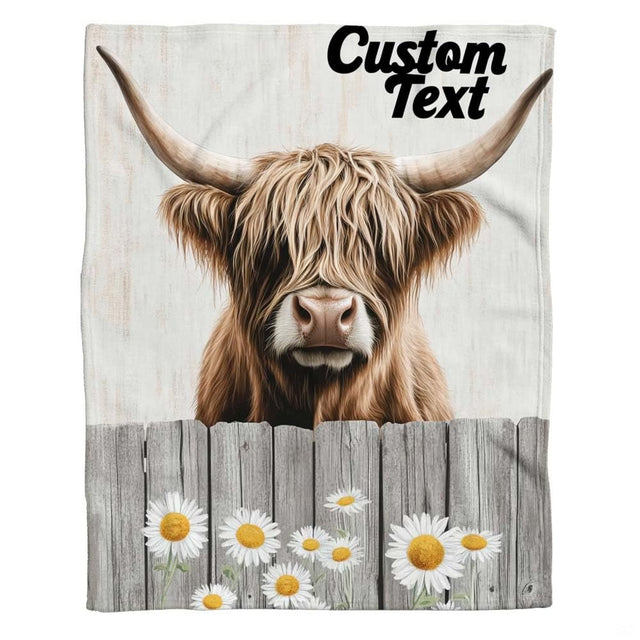Rustic daisy fence Highland cow throw blanket view 2 styled on living room couch in farmhouse home