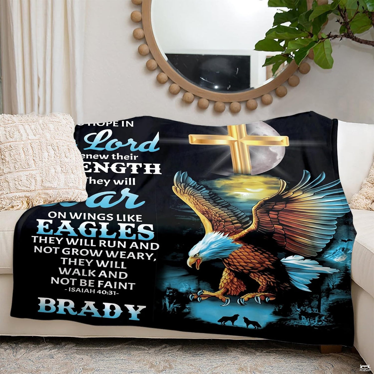 Decorative throw blanket draped over indoor living room seating showcasing night forest artwork.