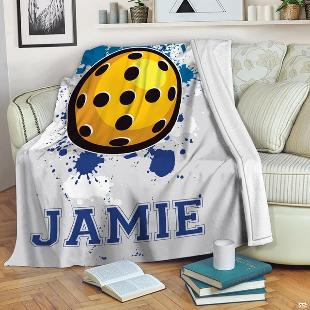 Bedding showcasing athletic court artwork with yellow perforated ball on a heathered gray backdrop.