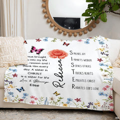 Wildflower butterfly blanket arranged across living room sofa under mirror.