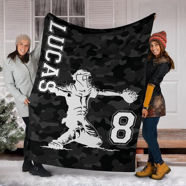 Camouflage baseball catcher athletic blanket held upright by models outdoors
