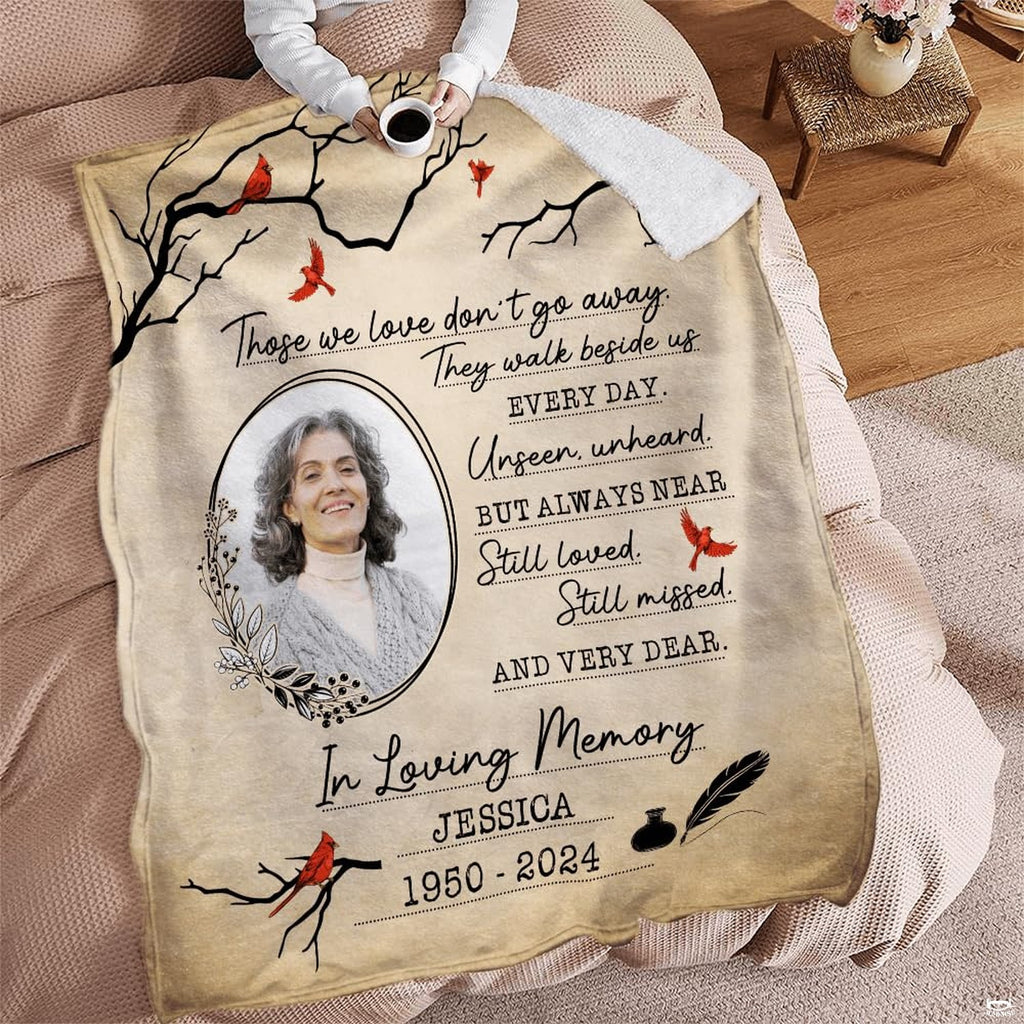Memorial cardinal throw blanket styled across a cozy armchair