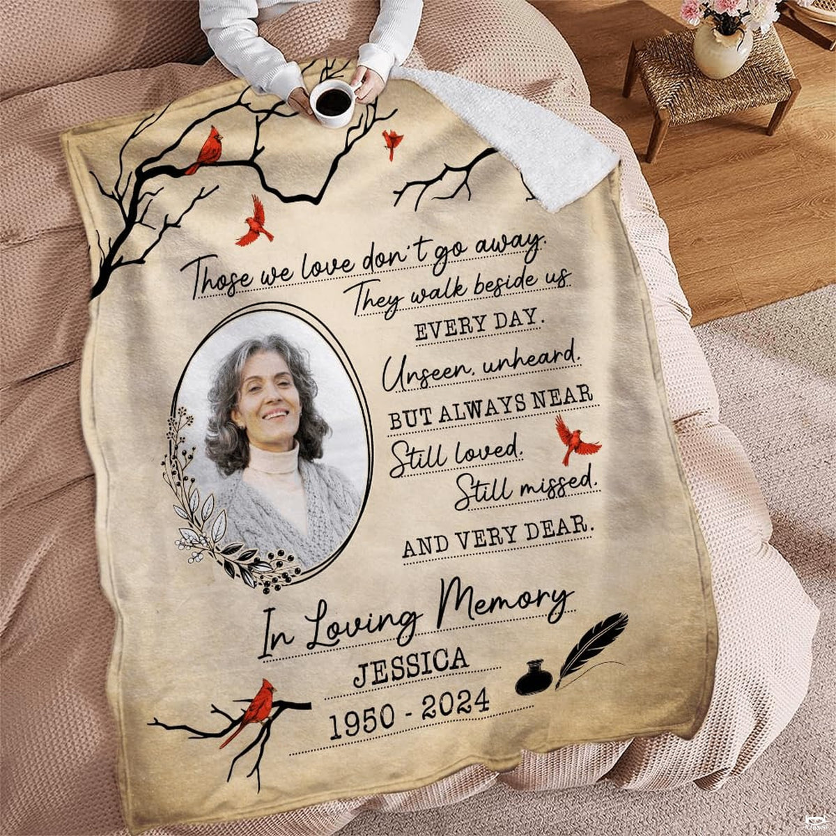 Memorial cardinal throw blanket styled across a cozy armchair