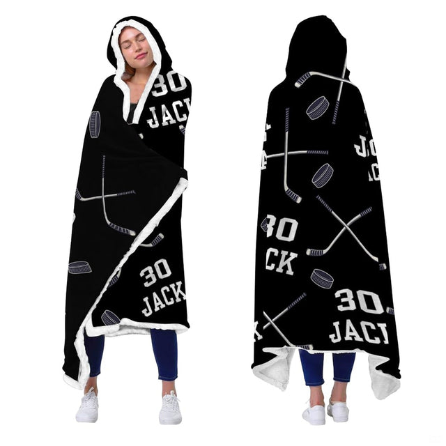 Sports bedding set design featuring crossed hockey sticks and varsity jersey numbers on black.