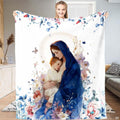 Madonna and Child blanket showing Blessed Virgin holding Baby Jesus framed by blush flowers.