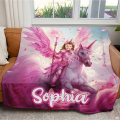 Living room lifestyle shot of pink unicorn blanket draped over brown leather sofa