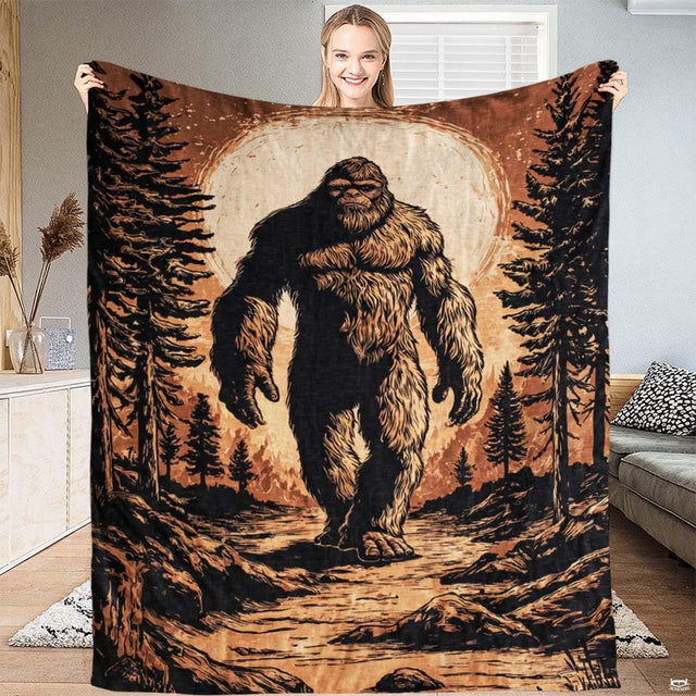 Vintage Bigfoot moonlit forest throw blanket featuring an engraved Sasquatch walking before a giant full moon