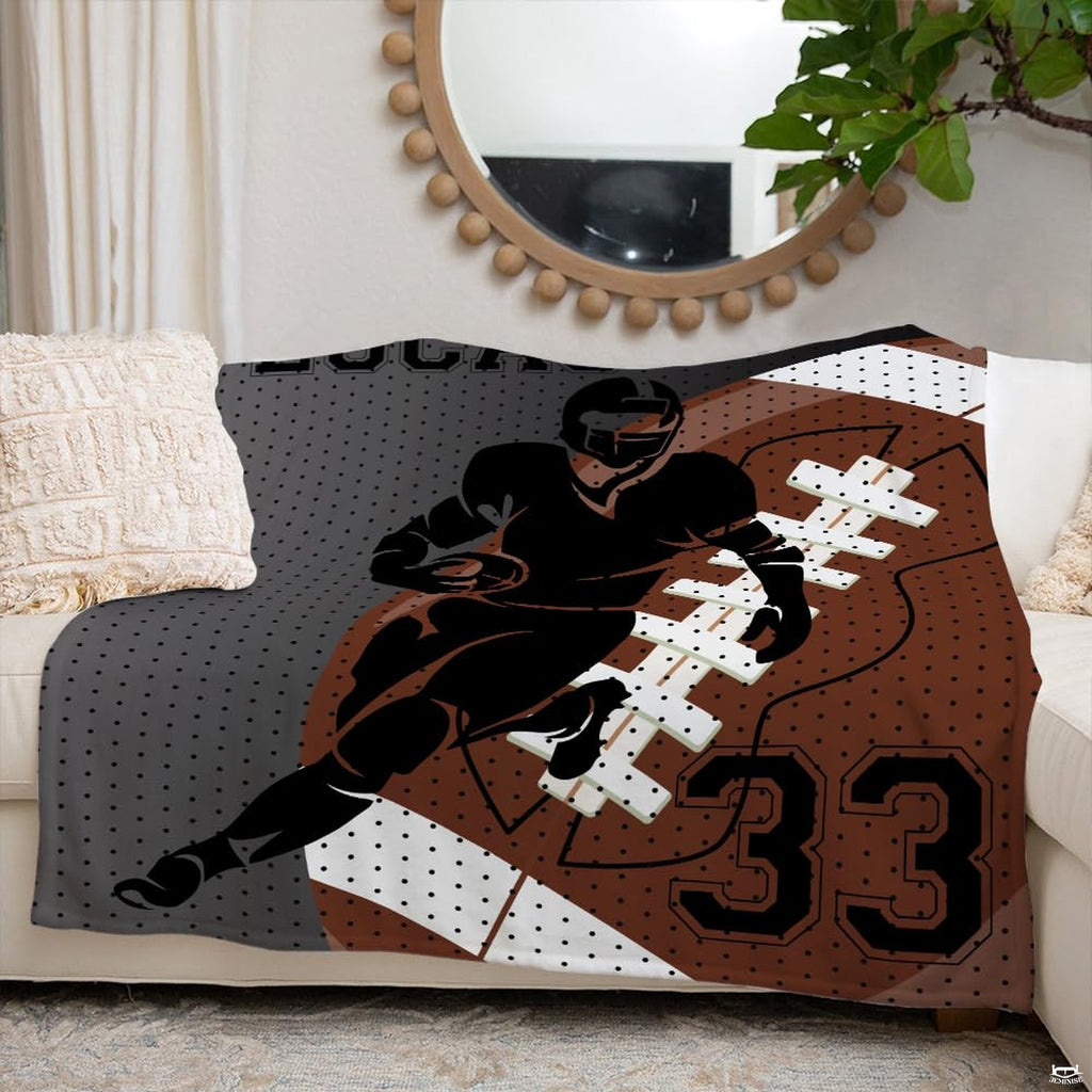 Overhead perspective of football themed bed decor with dynamic athlete silhouette and pigskin textures.