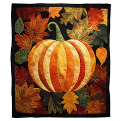 Autumn quilted patchwork pumpkin throw blanket held open by woman