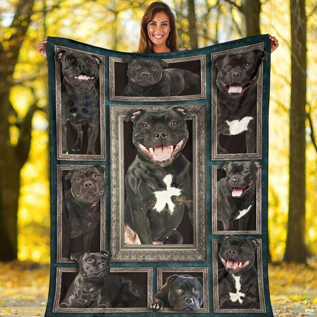 Outdoor view of a model holding up the full Staffordshire Bull Terrier gallery throw blanket.