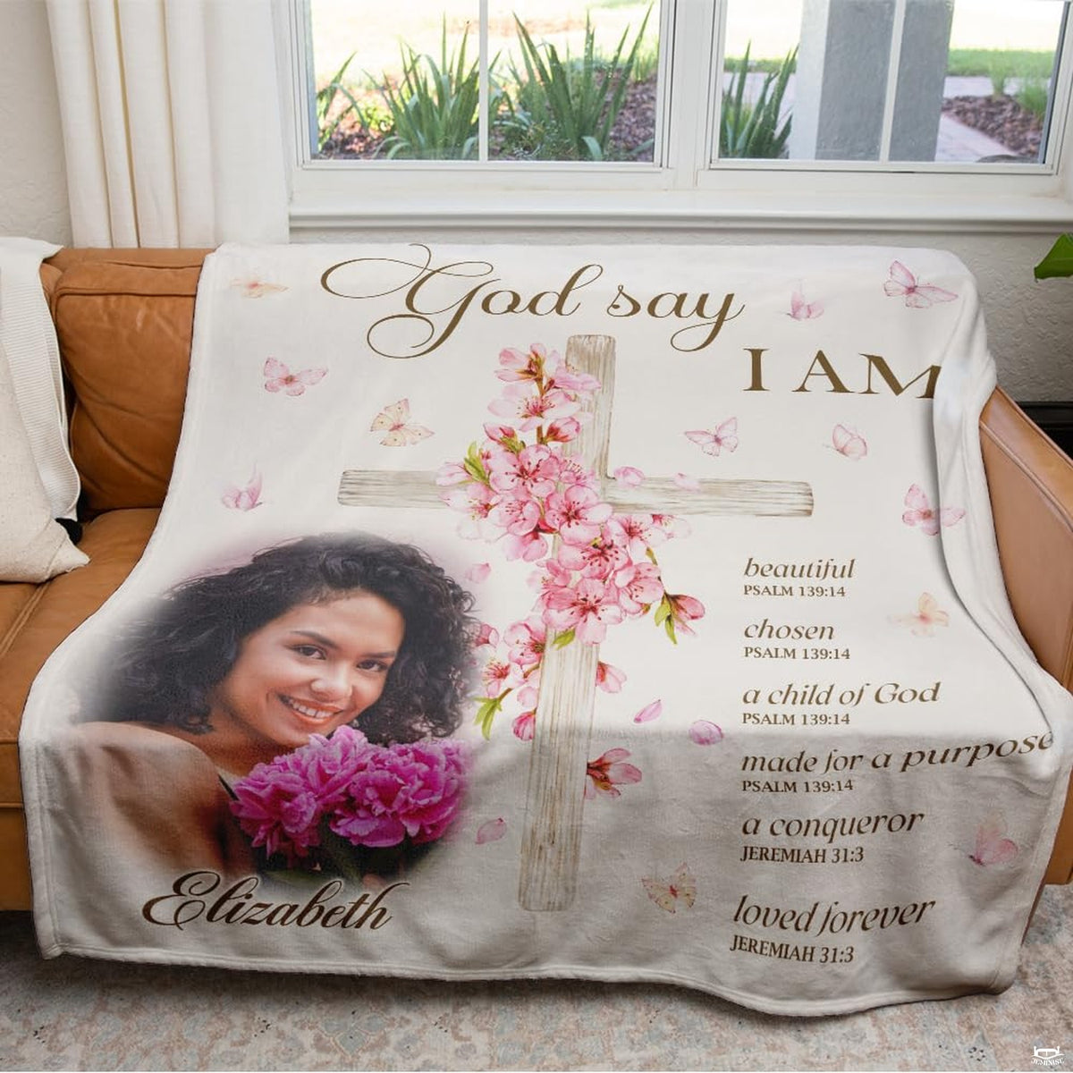 Overhead flat view of floral wooden cross scripture throw blanket