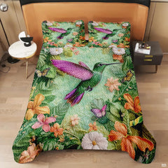 Green and magenta hummingbird bedding shown on a modern bed