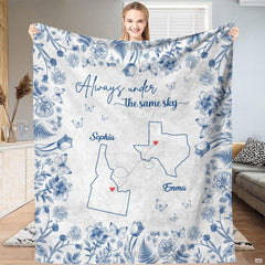 Blue botanical state map throw blanket featuring cobalt floral border and connected state outlines