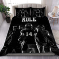 Monochrome black football sports bedding featuring textured football graphic and yard lines on a bed