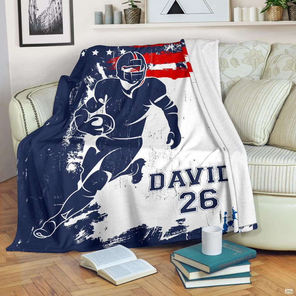 Patriotic athletic runner graphic blanket styled across bedroom bed
