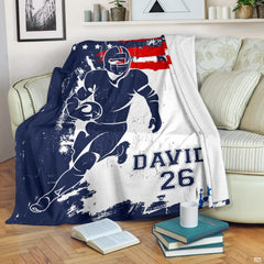Patriotic athletic runner graphic blanket styled across bedroom bed
