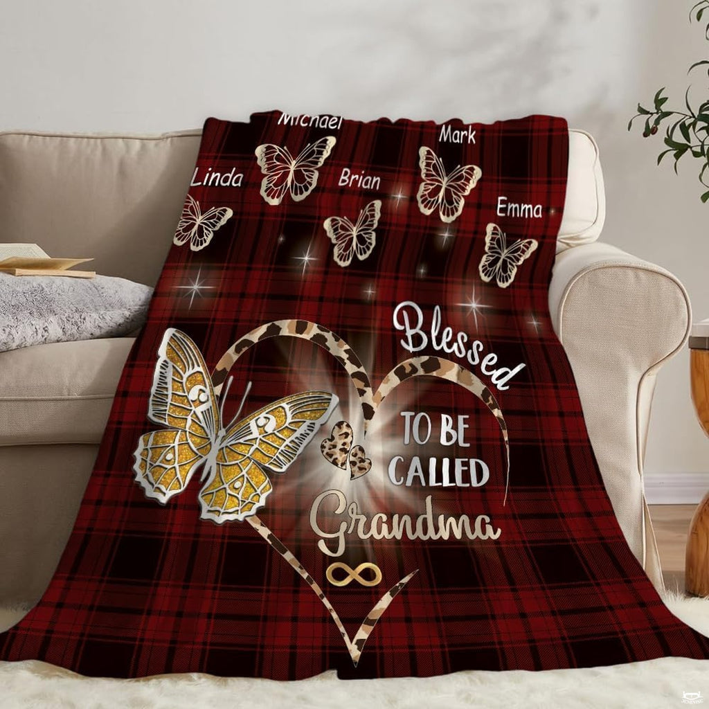 Red tartan butterfly graphic drape arranged on couch with mirror