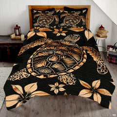 Batik sea turtle bedding set featuring Polynesian floral patterns in amber beige on deep black.