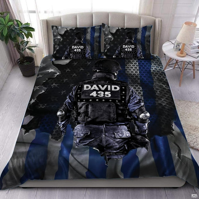 Rear-facing tactical figure over torn flag layers, deep blue stripes, stars, and perforated metal