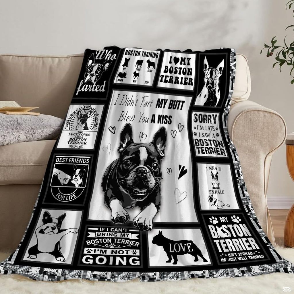 Decorated bedroom corner highlighting playful pet art motif and clean monochrome patchwork bedding.