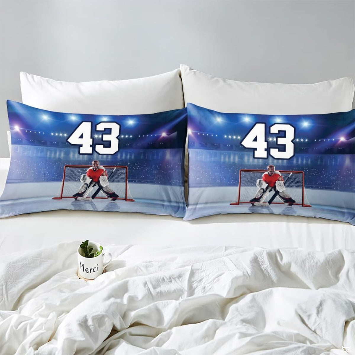 Side angle view of athletic winter sports bedding showing royal blue and scarlet red tones on mattress