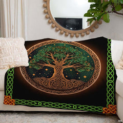 Detailed view of emerald green interlaced knotwork border framing Celtic Tree of Life throw blanket