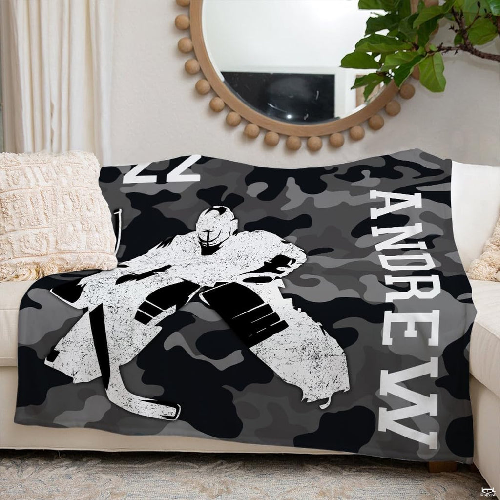 Interior decor presentation showing goalie design arranged on a sofa beneath a round mirror.