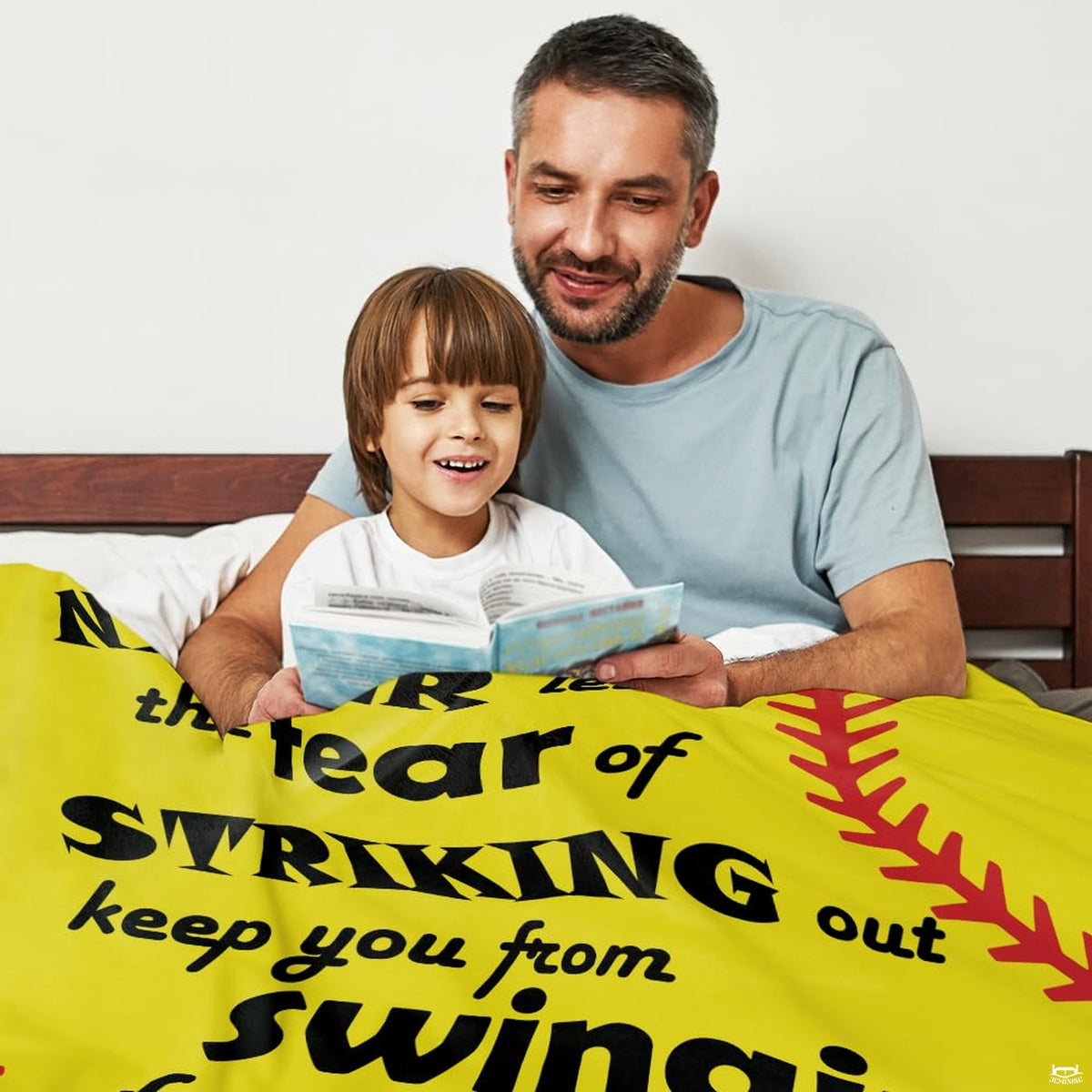 Living room setting featuring inspirational softball throw blanket draped across home sofa seating