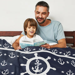 Maritime steering wheel anchor navy blanket arranged over living room armchair