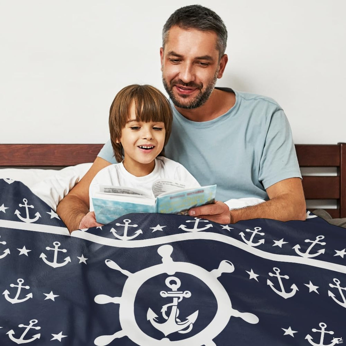 Maritime steering wheel anchor navy blanket arranged over living room armchair