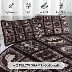 Moody bedroom styling with gothic halloween bedding showcasing black cat, perched raven, and bat patchwork grid artwork.