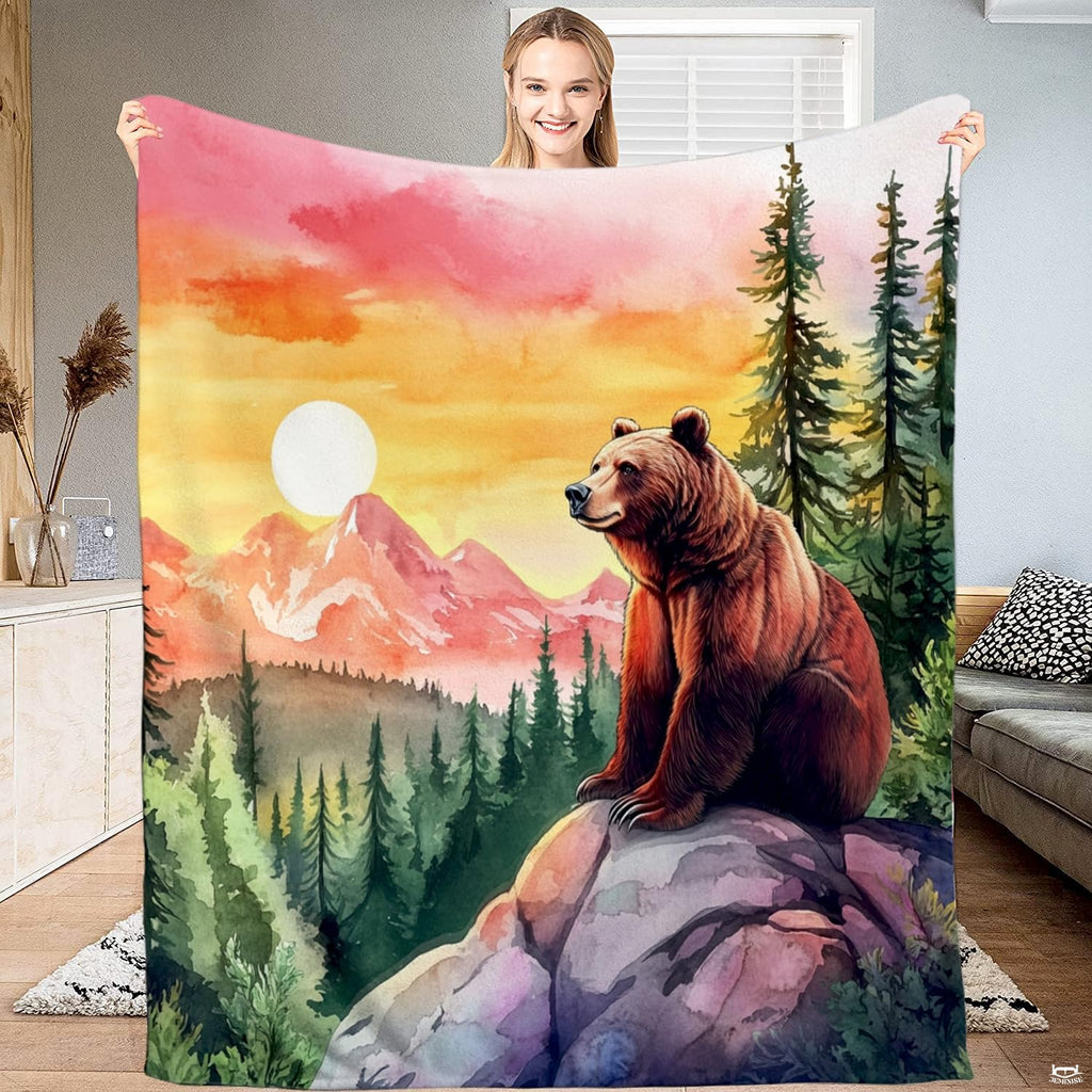 Rustic mountain bedding displaying a grizzly bear on a cliff over pine forests at sunset.