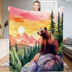 Rustic mountain bedding displaying a grizzly bear on a cliff over pine forests at sunset.