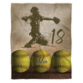 Softball catcher throw blanket showing catcher silhouette and trio of optic yellow softballs on wood.