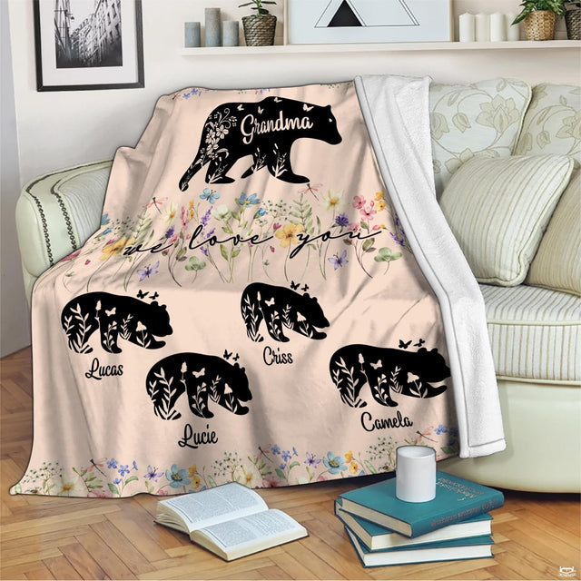 Detailed view of botanical floral patterns and delicate butterflies decorating woodland bear silhouettes.