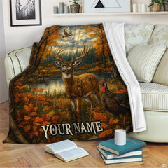 Whitetail buck with magnificent antlers standing by lakeside autumn trees and flying mallard wildlife art.