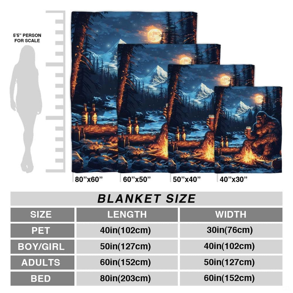 Close up of Bigfoot throw blanket highlighting glowing campfire flames, drink glass, and mountain peak