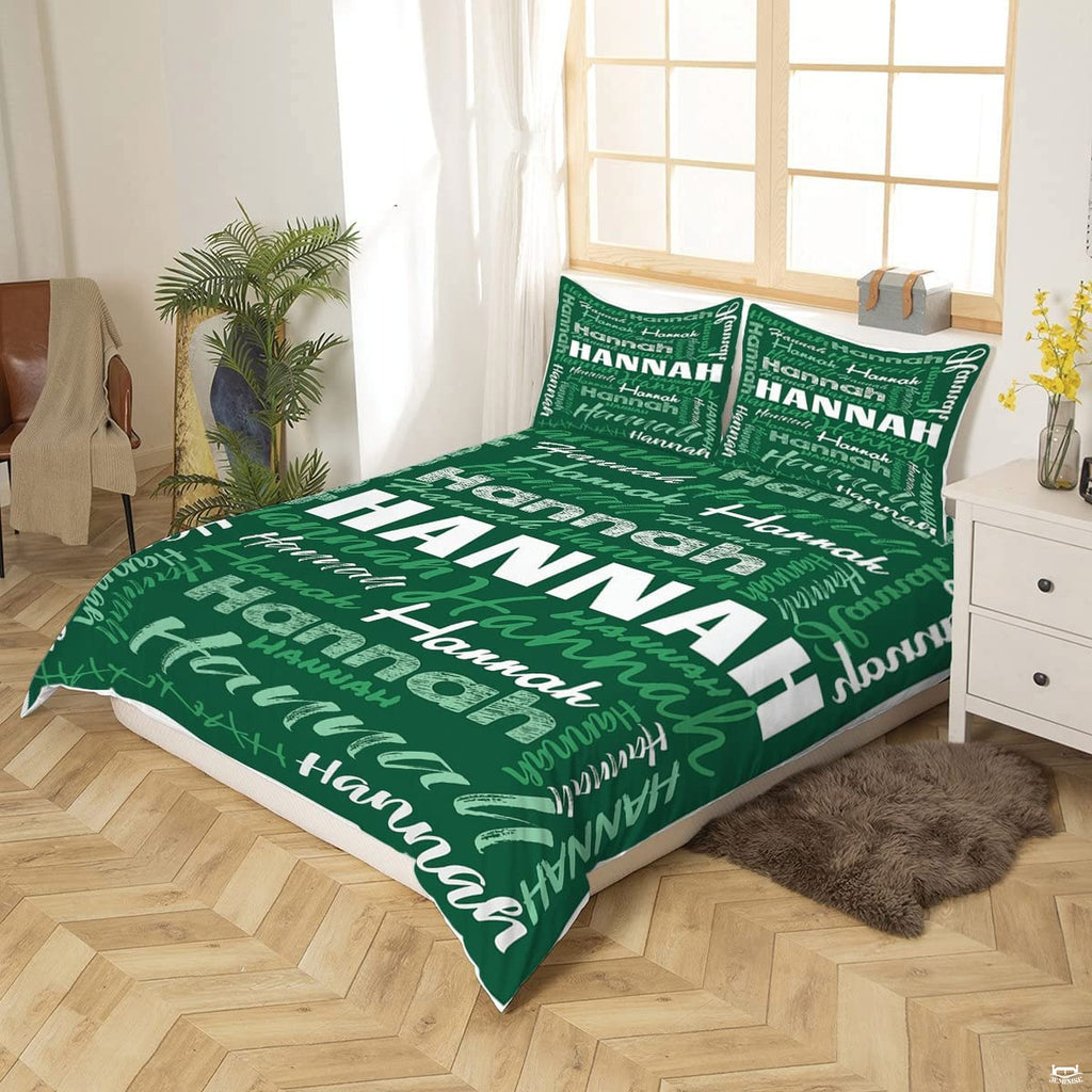 Close-up perspective of green typography bedding showing textured chalk lettering and calligraphy brushstrokes