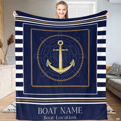 Nautical anchor and ship wheel graphic with golden tones on navy sailor stripes.