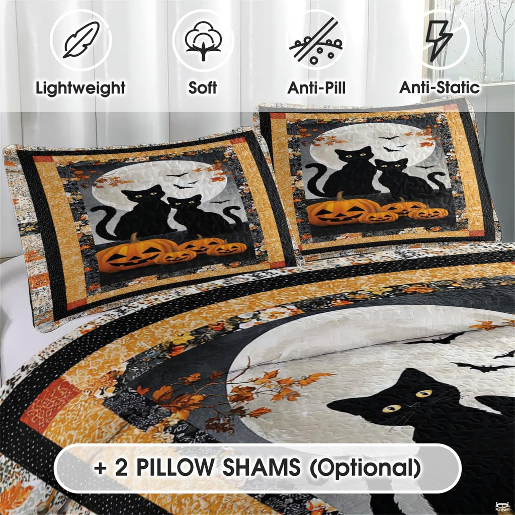 Close-up detail of Halloween cat bedding displaying stylized black cat faces, creeping vines, and starry motifs.