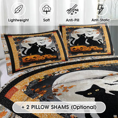 Close-up detail of Halloween cat bedding displaying stylized black cat faces, creeping vines, and starry motifs.