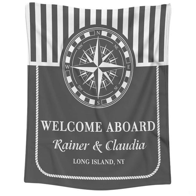 Nautical compass rose navy stripe throw blanket held open showing geometric seafaring artwork