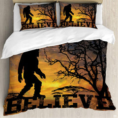 Bigfoot sunset bedding featuring a dark Sasquatch silhouette and Believe typography against an amber sky