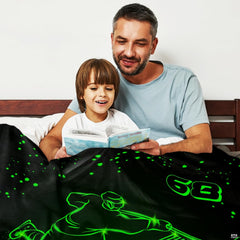 Overhead perspective of dark sports bedding featuring glowing green jersey typography and puck streaks.