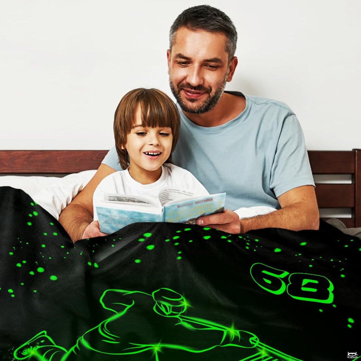 Overhead perspective of dark sports bedding featuring glowing green jersey typography and puck streaks.