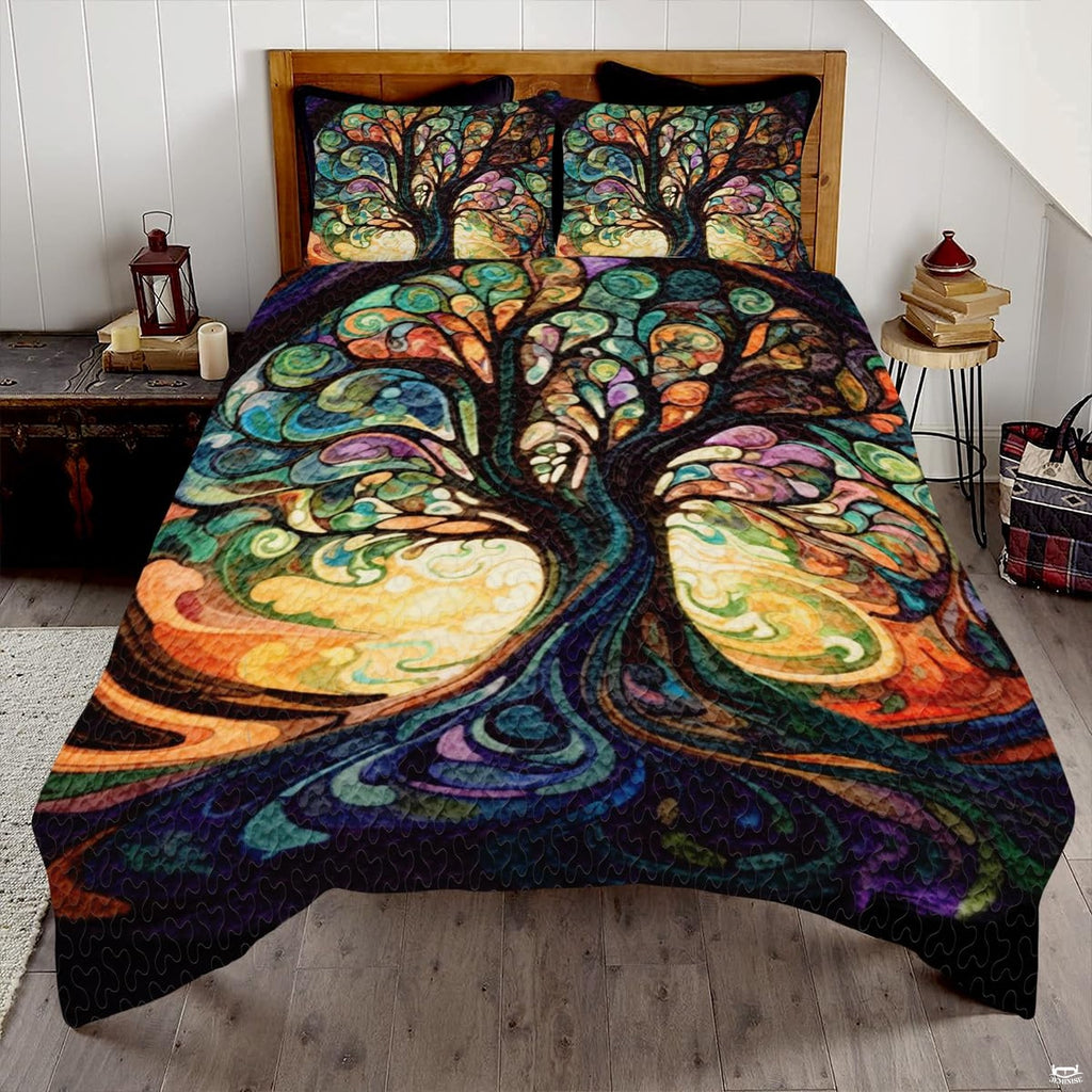 Stained glass Tree of Life bedding displaying colorful mosaic tiles and swirling roots on a bedroom mattress