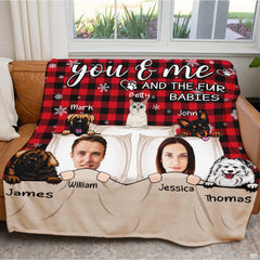 Illustrated couple and cartoon pets on red and black buffalo plaid background, view 8.
