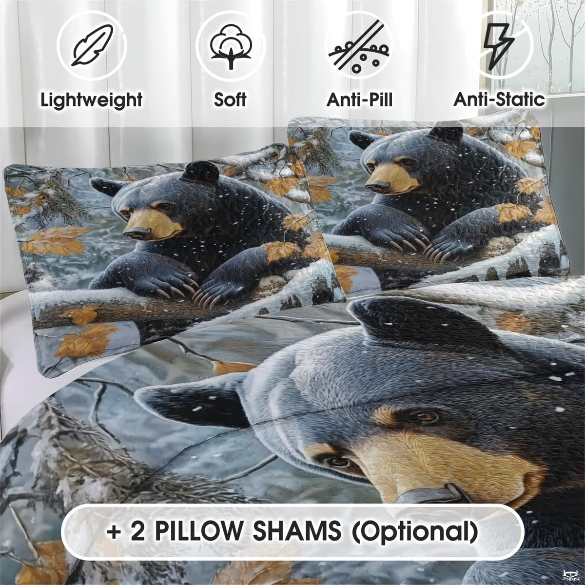 Black bear bedding artwork featuring falling snowflakes and golden autumn oak foliage.