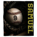 Baseball in fielding mitt throw blanket featuring baseball resting inside dark fielding mitt on dugout bench
